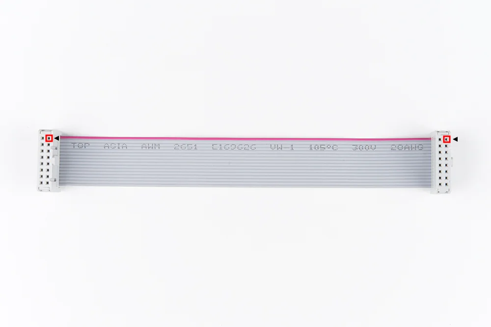 Real IDC ribbon cable with red edge stripe and pin-one positions highlighted at both connectors